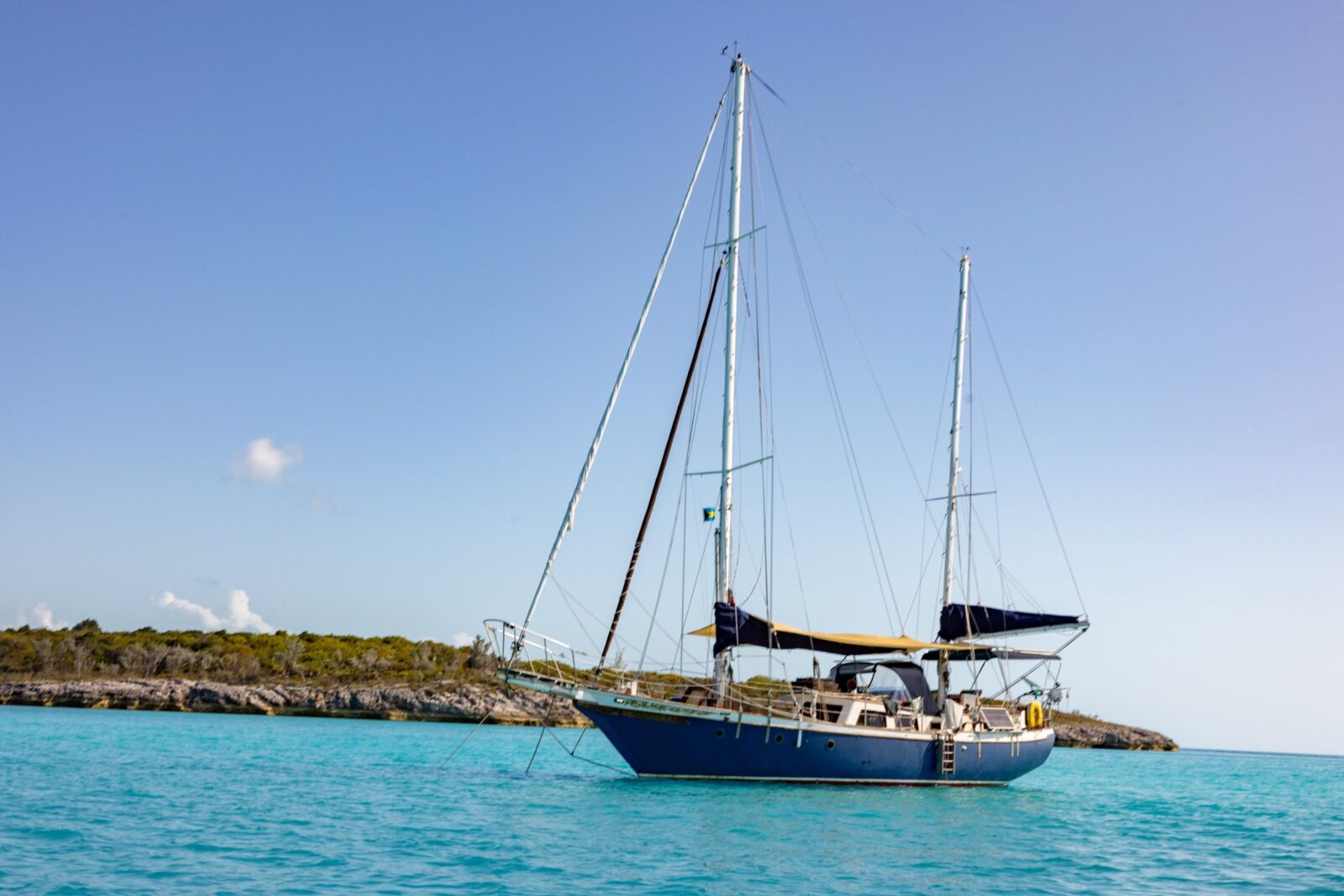 Starchaser at anchor in clear turquoise water